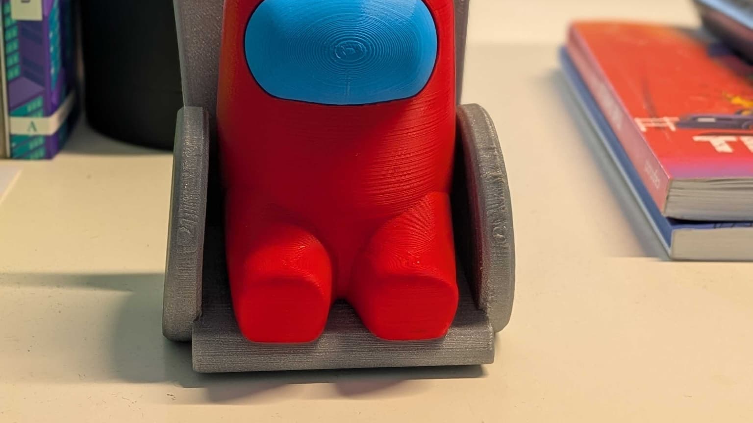 Le Coach photo peut suggérer d'utiliser le mode Portrait pour des figurines.