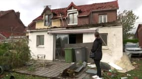 Ombeline devant sa maison d'enfance dévastée à Bihucourt, le 24 octobre 2022. 