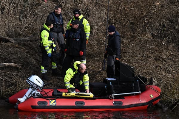 Search teams probe the river to try to find the 40-year-old man.