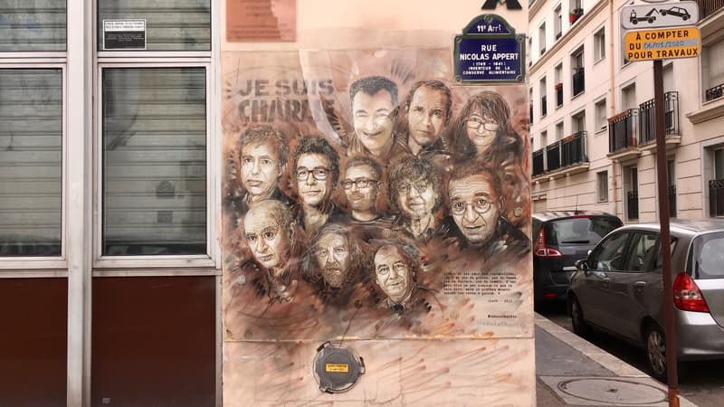 Les visages des journalistes de Charlie Hebdo ont été représentés par un graffeur sur la façade du bâtiment.