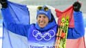 La joie du Français Quentin Fillon-Maillet, champion olympique de la poursuite aux Jeux de Pékin, le 13 février 2022 au centre national de biathlon de Zhangjiakou