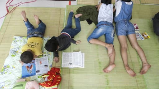 Des habitants évacués dans un abri le 10 juillet 2015 à Wenling Des habitants évacués dans un abri le 10 juillet 2015 à Wenling