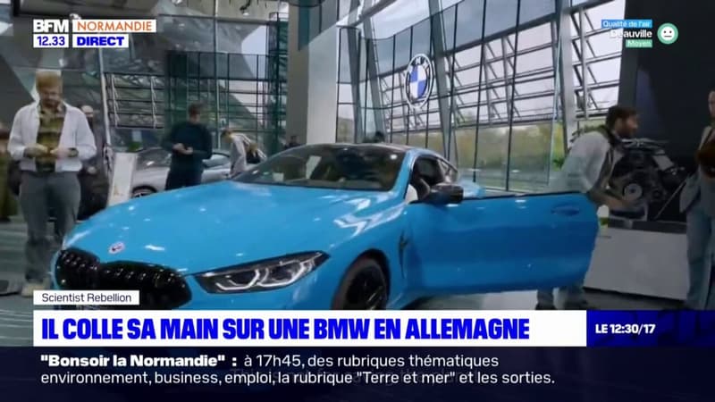 Rouen: un docteur en écologie colle sa main à une BMW pour alerter sur la pollution en Allemagne