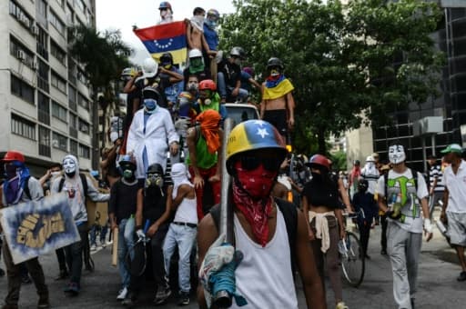 Manifestation d'opposants au président vénézuélien Nicolas Maduro, le 22 mai 2017 à Caracas Manifestation d'opposants au président vénézuélien Nicolas Maduro, le 22 mai 2017 à Caracas