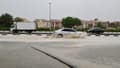 Des véhicules circulent sur une route inondée lors de pluies torrentielles dans l'émirat du Golfe de Dubaï, le 16 avril 2024.