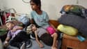 Des enfants palestiniens eçoivent un traitement contre la malnutrition à l'hôpital des martyrs d'Al-Aqsa à Deir al-Balah, dans le centre de la bande de Gaza, le 30 mai 2024, dans le contexte du conflit en cours entre Israël et le groupe militant palestinien Hamas.
