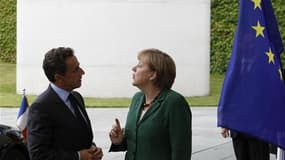 Nicolas Sarkozy rencontrera Angela Merkel mardi prochain à l'Elysée pour faire des "propositions communes sur la réforme de la gouvernance de la zone euro avant la fin de l'été". /Photo d'archives/REUTERS/Tobias Schwarz