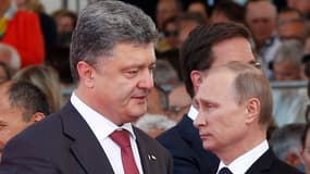 Les deux présidents Petro Poroshenko et Vladimir Poutine lors des commémorations du Débarquement, en France, le 6 juin dernier.