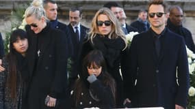 Laeticia Hallyday, Laura Smet et David Hallyday aux obsèques de Johnny à La Madeleine, le 9 décembre 2017