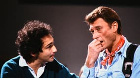 Michel Berger et Johnny Hallyday sur le plateau de l'émission "Le grand échiquier" le 3 novembre 1985.