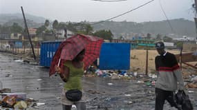 A Port-au-Prince, où certaines zones ont été inondées lors du passage de la tempête tropicale Isaac. Isaac perd en puissance après avoir déversé de fortes pluies et provoqué des vents violents sur Haïti, tôt samedi, mais devrait se renforcer à nouveau à l