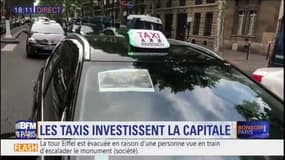 Opérations escargot: plusieurs centaines de taxis bloquent le boulevard Saint-Germain, dans le 7e arrondissement de Paris: la circulation complètement à l'arrêt