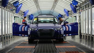 This photo taken on November 1, 2017 shows a Chinese employee working on a production line of automobiles at a factory in Changchun in China's northeastern Jilin province.