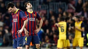L'attaquant Lionel Messi et le milieu de terrain du FC Barcelone Cesc Fabregas ce mardi 1er avril à Barcelone, lors du quart de finale aller de la Ligue des Champions.