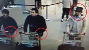L'homme de droite est activement recherché par la police belge.