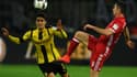 Le défenseur de Dortmund, Marc Bartra (en jaune), face au Munichois Robert Lewandowski. 