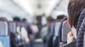 Un passager dans un avion. (Illustration)