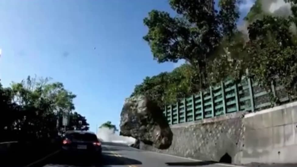 the spectacular image of a huge rock hitting a car