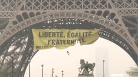 Des militants de Greenpeace déploient une banderole anti-FN à la Tour Eiffel