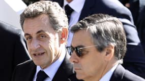 François Fillon et Nicolas Sarkozy à Nice, le 14 juillet 2016. (Photo d'illustration)