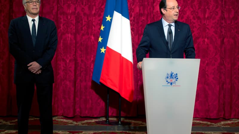 Le président de la République François Hollande et le ministre du Travail François Rebsamen
