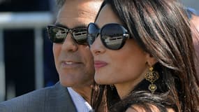 George Clooney et sa fiancée Amal Alamuddin, le 26 septembre, à quelques jours de leur mariage à Venise.