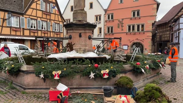 Les équipes s'activent pour faire resplendir la fontaine, place emblématique d'Eguisheim.