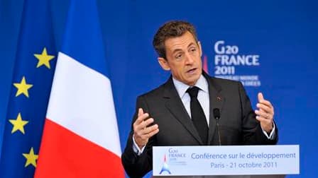 Nicolas Sarkozy en a appelé vendrredi aux opinions publiques pour forcer les pays riches à accepter la mise en place d'une taxe sur les transactions financières, lors d'une conférence sur le développement dans le cadre du G20. /Photo prise le 21 octobre 2