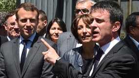 Emmanuel Macron, Marisol Touraine et Manuel Valls lors d'un déplacement en Ardèche pour un comité interministériel sur la ruralité, le 20 mai 2016. 