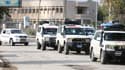 Un convoi d'ambulances quittant la ville de Ras Al-Ain, en Syrie, transportant des blessés du FDS