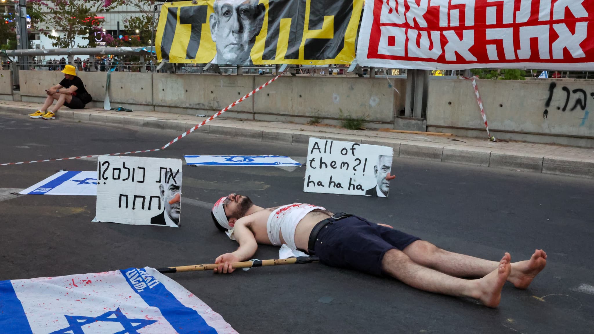 A protester covered with false blood during a demonstration that asks for an action to obtain the release of Israeli hostages before the Ministry of Defense in Tel Aviv on May 31, 2025. A protester covered with false blood during a demonstration that asks for an action to obtain the release of Israeli hostages before the Ministry of Defense in Tel Aviv on May 31, 2025.