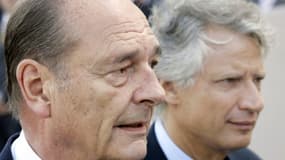 L'ancien président Jacques Chirac (g) et son Premier ministre de l'époque, Dominique de Villepin, le 14 juillet 2005 à Paris