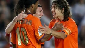 Carles Puyol, Ronaldinho et Lionel Messi