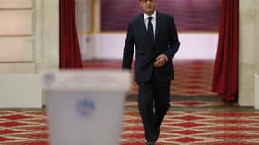 François Hollande arrive à son pupitre, le 18 septembre, lors d'une conférence de presse à l'Elysée.