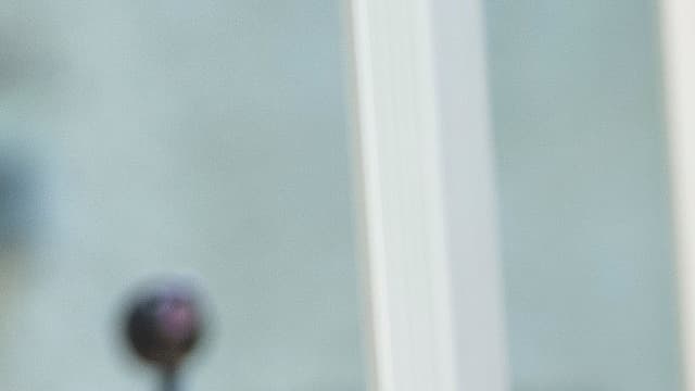 Bernard Cazeneuve ) Fontaines-sur-Saône, dans le Rhône, le 26 juin, aux côtés de la veuve d'Hervé Cornara.