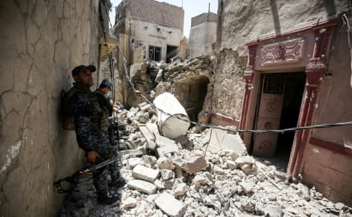 Des membres de la police fédérale irakienne dans  une rue de la Vieille ville de Mossoul, le 28 juin 2017