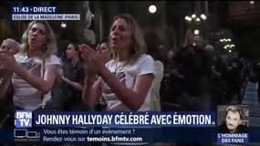 Debout, les fans de Johnny l'applaudissent à la Madeleine