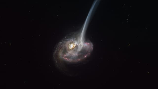 Une impression d'artiste de la galaxie ID2299, le produit d'une collision galactique, et une partie de son gaz est éjectée par une «queue de marée» à la suite de la fusion.
