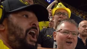 Mohamed Henni célébrant avec un fan du Borussia Dortmund le but de Niclas Fullkrug face au PSG