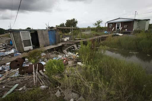 Une maison endommagée par l'ouragan Katrina sur l'Isle de Jean Charles et laissée à l'abandon, le 16 août 2015 Une maison endommagée par l'ouragan Katrina sur l'Isle de Jean Charles et laissée à l'abandon, le 16 août 2015