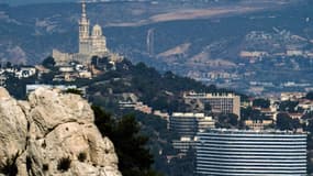 A general view of Marseille and the Notre-Dame-de-la-Garde basilica (Rear L) is seen on October 19, 2017.