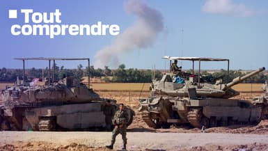 Des chars de l'armée israélienne prennent position dans le sud d'Israël, près de la frontière avec la bande de Gaza, alors que de la fumée s'élève lors d'un bombardement israélien, le 6 mai 2024.