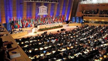 Des délégués prennent part au vote au siège de l'Unesco à Paris. La Palestine a fait un pas vers la reconnaissance internationale qu'elle appelle de ses voeux en devenant lundi membre à part entière de l'Unesco. Cette reconnaissance suscite des réticences