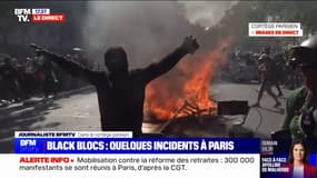 Retraites: un feu allumé par les black blocs sur le parcours du cortège