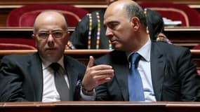 L'entourage de Bernard Cazeneuve, le ministre du Budget (à gauche), a fait savoir que le gouvernement était défavorable à l'élargissement de la taxe sur les transactions financières.