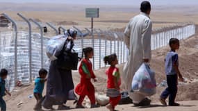 Une famille d'Irakiens dans un camp de réfugiés à 40 kilomètres d'Arbil, le 27 juillet dernier. 