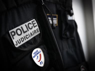 Un badge de Police Judiciaire