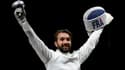 La joie de l'épéiste français Romain Cannone, champion olympique après sa victoire en finale, 15 touches à 10 face au Hongrois Gergely Siklosi, aux Jeux Olympiques de Tokyo 2020, le 25 juillet 2021