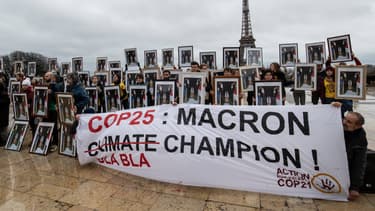 Marche pour le climat du 8 décembre 2019 à Paris, où 100 portraits d'Emmanuel Macron ont été brandis pour dénoncer l'inaction du gouvernement français
