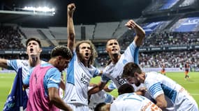 Les joueurs de l'OM célèbrent leur succès à Montpellier